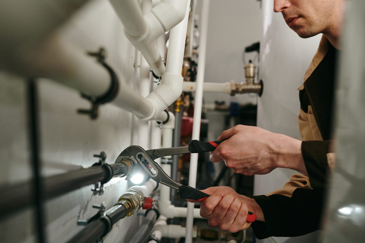 Plumbers maintaining commercial plumbing pipes in Palm Harbor